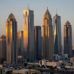 Emerging market cityscape with modern skyscrapers at sunrise.